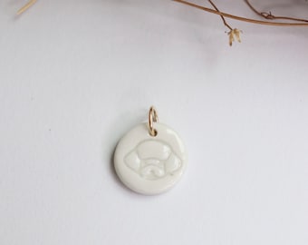 Small artisan porcelain ceramic bichon dog round charm pendant