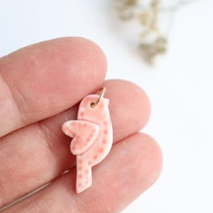 Handmade porcelain bird charm pendant