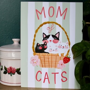 Pôster ilustrado do Dia das Mães – colaboração Bananes Parallèle x Un chat dans la Maison – gato preto, flores e ternura - Mum cat