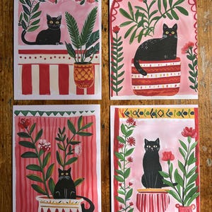 Lot de 4 cartes postales illustrées – Chats noir et fleurs, Format A6, Papier premium mat 300g - "Le jardin du chat noir"