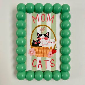 Tarjeta ilustrada del Día de la Madre – colaboración Bananes Parallèle x Un chat dans la Maison – amantes de los gatos, A6 plegable - Día de la Madre