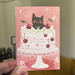 Carte d’anniversaire pliable – "Le chat malicieux et son gâteau aux cerises" – Carte A6 - papier premium
