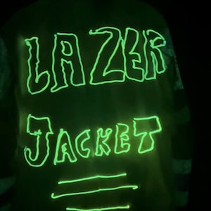 May include: A green glow-in-the-dark jacket with the words "LAZER JACKET" written on the back.