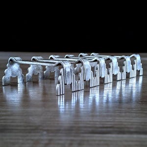 Christofle Paris Porte-couteaux / Cutlery Rests, Set of Six Early 20th Century Art-Deco finished with Silverplate Circa 1920/1930.
