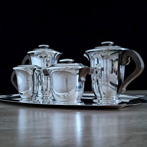 Ravinet d&#39;Enfert Tea and Coffee Service, 20th Century Art Deco finished with Brilliant Silverplate Circa 1930.