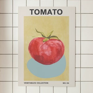 May include: A vintage-style poster with the word "TOMATO" in bold black letters. The poster features a watercolor illustration of a red tomato on a light blue background. The text "VEGETABLES COLLECTION NO. 04" is at the bottom of the poster.
