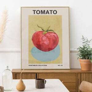 May include: A vintage-style poster with a yellow background featuring a red tomato with green leaves. The poster has the word "TOMATO" in black text at the top and "VEGETABLES COLLECTION NO. 04" at the bottom.