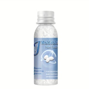 May include: A clear plastic bottle filled with white moldable false teeth pellets. The bottle label reads "Moldable False Teeth" and lists features such as "Reusable", "Super strong", and "non-toxic".