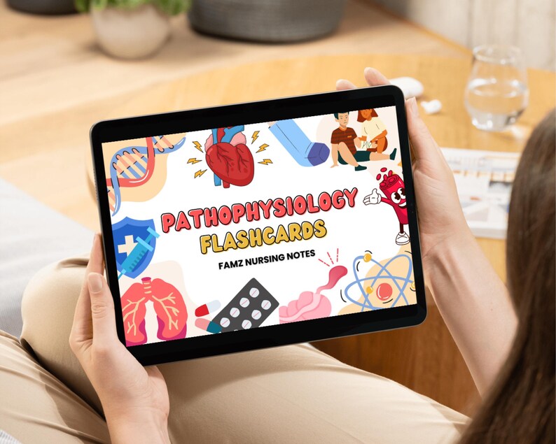 May include: A digital tablet displaying a colorful graphic with the text "Pathophysiology Flashcards" and "Famz Nursing Notes". The graphic includes illustrations of a heart, lungs, DNA, and a syringe.