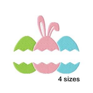 May include: Embroidered design of three cracked Easter eggs with a pink bunny peeking out of the middle egg. The eggs are green, pink, and blue.