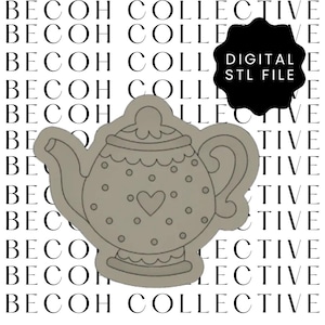 May include: A gray teapot cookie cutter with a heart design and polka dots. The cutter is designed for making cookies or fondant decorations.