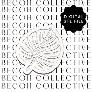 May include: A white, stylized Monstera leaf design, a digital STL file. The leaf has detailed vein patterns and a smooth, clean outline. The background features the text "BECOH COLLECTIVE" in a repeating pattern, with a black tag that says "DIGITAL STL FILE".