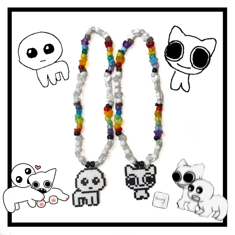 May include: Two rainbow beaded necklaces with pixelated white cat charms. The charms are of a cat with large eyes and a small mouth. The necklaces are on a white background with drawings of cartoon cats and a heart.