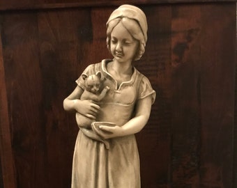 Girl with cat (1905-1920), antique Dutch statue sculpture, famous statue made by Gebroeders van Paridon.