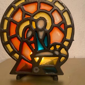 Beautiful antique small candlestick. Mary and Joseph and baby Jesus behind stained glass. Rare unique object. Height 13 cm, 5.1 inch