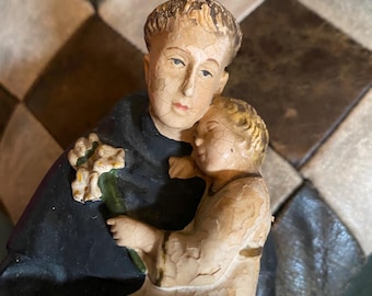 古いアンティークの彫像、パドヴァの聖アントニオと幼子イエス。非常に