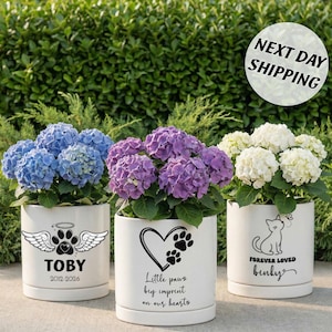 May include: A set of three ceramic mugs with a speckled, matte finish. The mugs are in shades of cream, light gray, and dark gray. Each mug has a simple, minimalist design and a rounded handle. The mugs are suitable for coffee, tea, or other beverages.