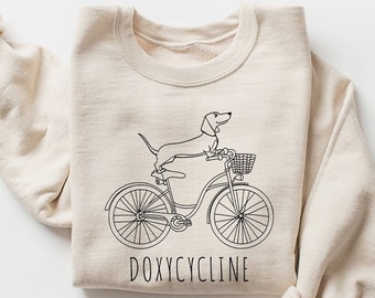 Doxycycline Pharmacy Pun Sweatshirt, Dachshund on Bicycle, Pharmacists Shirt, Pharmacists and Technicians Gift, Veterinary, Pharmacist Gifts