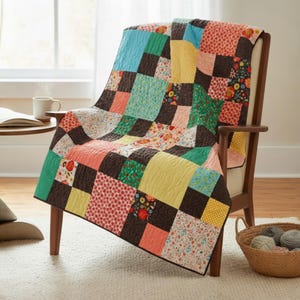 May include: A patchwork quilt draped over a wooden armchair. The quilt features squares of various colors and patterns, including floral, polka dots, and solid colors. The color palette includes shades of blue, green, yellow, pink, and brown. A basket of yarn sits nearby.