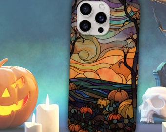 May include: A stained glass style iPhone case with a sunset scene and pumpkins. The case is designed for an iPhone with a camera bump.