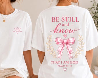 Be Still Christian T-Shirt, Psalm 46:10 Bible Verse, Pink Bow Graphic Tee
