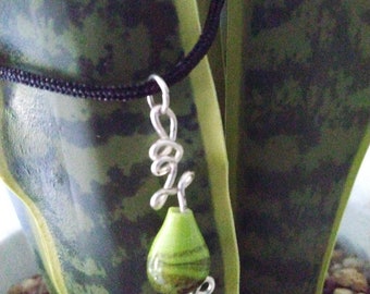 Two toned green glass bead