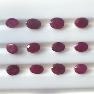 May include: A handmade wooden sign with the text "Welcome" in a handwritten style. The sign is painted white with a distressed finish, and a small green leaf is attached to the top. The sign is designed for home decor.