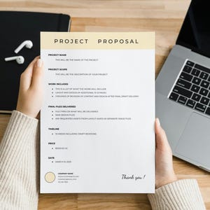 May include: A project proposal document with the title "Project Proposal" in a yellow box. The document includes sections for project name, project scope, work includes, final files delivered, timeline, price, and date. The document also includes a company name, website, and email address.