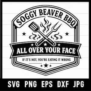 May include: Black and white graphic design for a BBQ-themed product. The design features the text "Soggy Beaver BBQ" above crossed spatula and fork, with the text "All Over Your Face" below. The phrase "If it's not, you're eating it wrong" is also included.