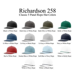 May include: A collection of Richardson 258 classic 5-panel rope hats displayed in various colors including black, dark grey, dark olive, kelly green, navy, red, smoke blue, soft blue, and white, each featuring a contrasting rope detail on the brim.