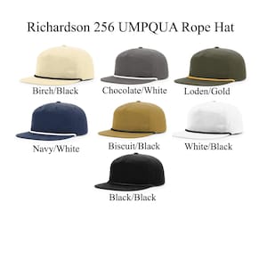May include: Richardson 256 UMPQUA Rope Hat in various colors, including birch with black trim, chocolate with white trim, loden with gold trim, navy with white trim, biscuit with black trim, white with black trim, and black with black trim.