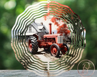 May include: A red tractor with a white farmhouse in the background. The tractor is driving down a dirt road with fall foliage on the trees. The image is on a metal wind spinner with a circular design.