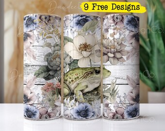May include: Three sublimation tumblers with a white woodgrain background, featuring a watercolor design of flowers, leaves, and a frog. The text "9 Free Designs" is printed on the top of the tumblers.