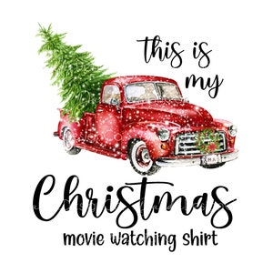 May include: Red vintage pickup truck with a Christmas tree in the back, covered in snow. The truck has a "XMAS" number plate. Text reads "This is my Christmas movie watching shirt".