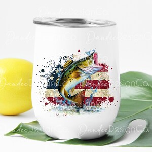 May include: White stainless steel wine tumbler featuring a graphic of a bass fish leaping from water against a backdrop of an American flag. The fish is green, brown, and yellow. The flag is red, white, and blue.