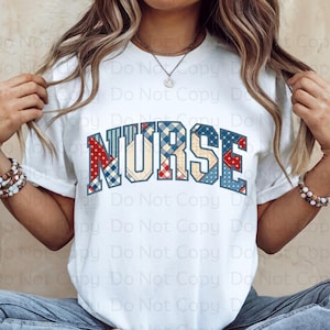 May include: A white t-shirt with the word "NURSE" in blue, red, and white patchwork letters. The letters are in a collegiate font style.
