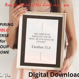 May include: A printable digital download of a Bible verse, "The Lord is my strength and my song: He has given me victory." Exodus 15:2, in a white frame with a black mat.