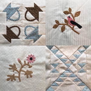 Può includere: Un quilt con quattro quadrati diversi. Il quadrato in alto a sinistra ha un motivo marrone e blu. Il quadrato in alto a destra ha un uccello marrone su un ramo. Il quadrato in basso a sinistra ha un fiore marrone. Il quadrato in basso a destra ha un motivo geometrico blu e bianco.