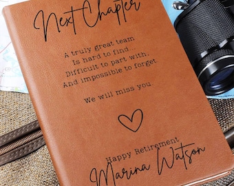 May include: A brown leather journal with the words "Next Chapter" in elegant script. The journal includes a heartfelt message, a heart symbol, and the words "Happy Retirement" and a name. A thoughtful retirement gift.