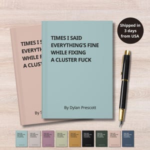 May include: Two books, one light pink and one teal, with the text "TIMES I SAID EVERYTHING'S FINE WHILE FIXING A CLUSTER FUCK" and "By Dylan Prescott". A black pen with gold accents rests on the right.