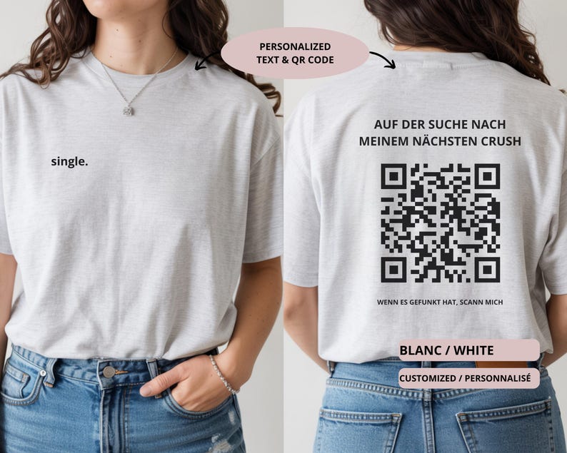 May include: Light gray t-shirt with the word "single" printed on the front. The back of the shirt features the text "AUF DER SUCHE NACH MEINEM N&Auml;CHSTEN CRUSH" and a QR code. The shirt is white and customizable.