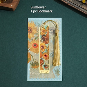 May include: Gold bookmark featuring a painting of sunflowers by Van Gogh. The bookmark has a tassel and the text "Van Gogh" and "We choose not to break through the simple love, nothing more than four firs."