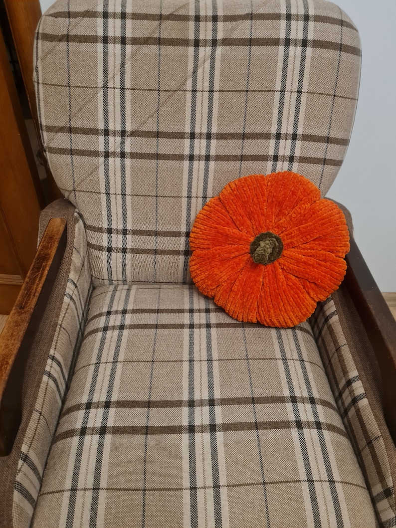pumpkin cushion on the chair