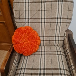 pumpkin cushion on the chair