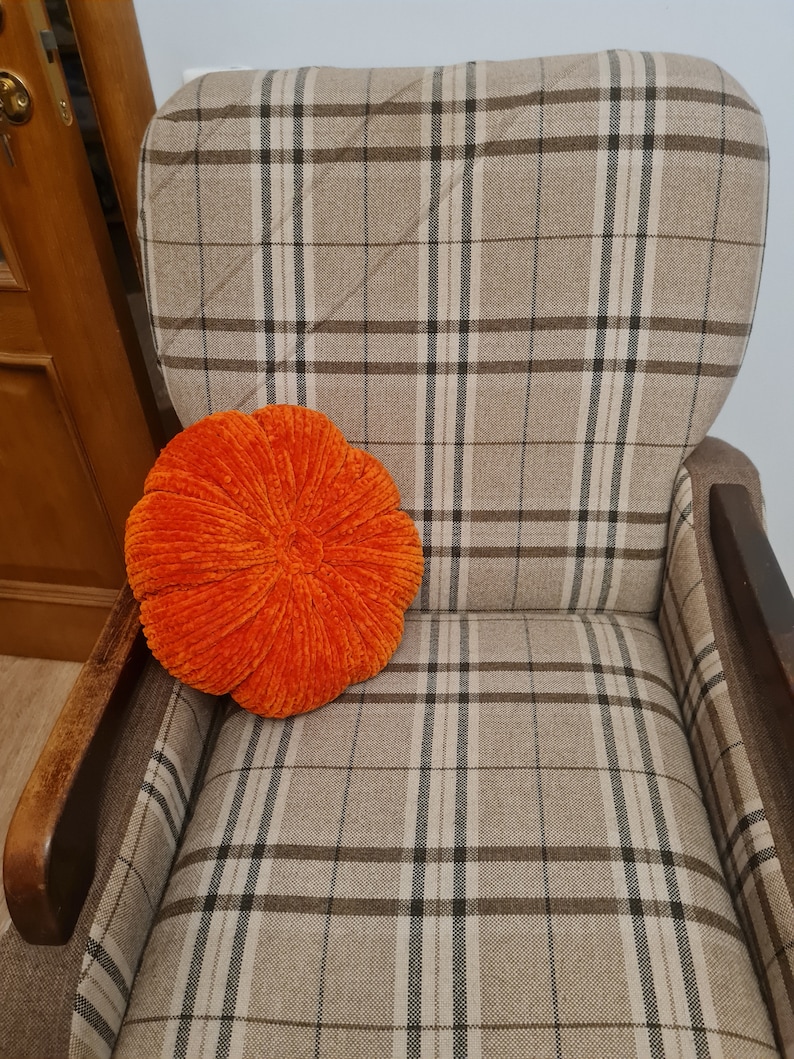 pumpkin cushion on the chair