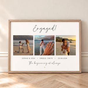 May include: A rectangular framed wall art print featuring three photographs of a couple on a beach. The text reads Engaged!, SOPHIE & JOSH | GREECE, CRETE | 25.08.2026, and The beginning of always. The frame is light wood with a white background.