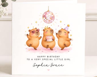 May include: A square birthday greeting card featuring an illustration of three capybaras dancing under a disco ball with the number 5. The card text reads: HAPPY BIRTHDAY TO A VERY SPECIAL LITTLE GIRL and the name Sophia Grace in script font.