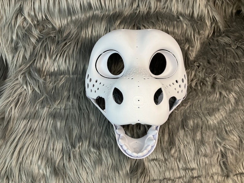 May include: White unpainted furry animal head base with open mouth and visible teeth. The base has large eye sockets and a textured nose.