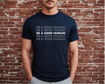 May include: A navy blue t-shirt with the text "BE A GOOD HUMAN" repeated five times in white.