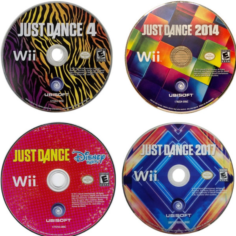 May include: Four Wii game discs featuring the "Just Dance" series. The discs are labeled "Just Dance 4", "Just Dance 2014", "Just Dance Disney Party", and "Just Dance 2017". Each disc has a unique colorful design and the Ubisoft logo.